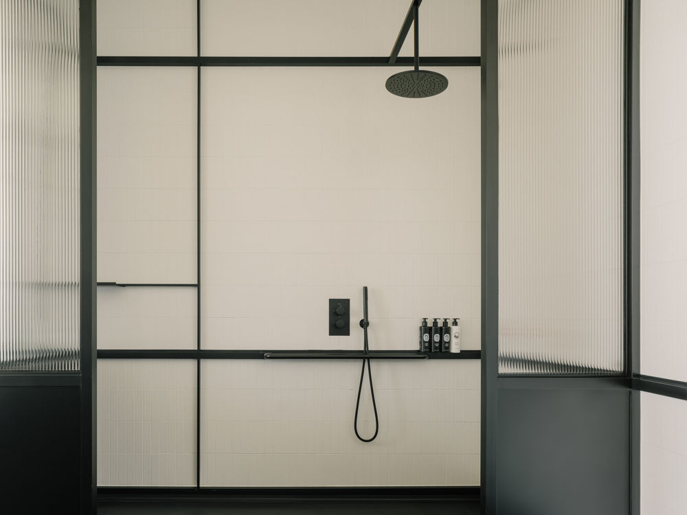 Neri & Hu designed corridor with dramatic scale and industrial lighting.